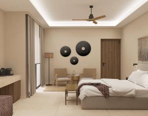 Łóżko lub łóżka w pokoju w obiekcie Τhe Noverian Antama Organic Beach Resort Chania