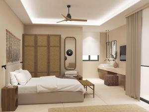 Łóżko lub łóżka w pokoju w obiekcie Τhe Noverian Antama Organic Beach Resort Chania