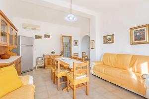 a living room with a couch and a table at Casa Marea in Marina di Gairo