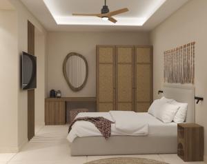 Łóżko lub łóżka w pokoju w obiekcie Τhe Noverian Antama Organic Beach Resort Chania