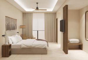 Łóżko lub łóżka w pokoju w obiekcie Τhe Noverian Antama Organic Beach Resort Chania