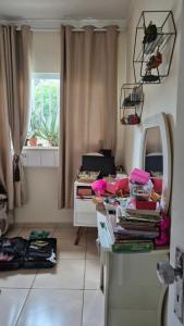 Χώρος καθιστικού στο Quarto Rosa só para Mulheres