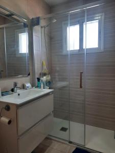 a bathroom with a glass shower and a sink at Preciosa finca con piscina R105 by Novadesta in Elche +15 photos