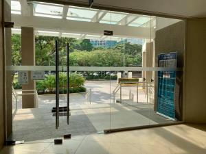 a lobby with a glass door in a building at Solinea T3 805-A Elegant studio in Cebu City +31 photos