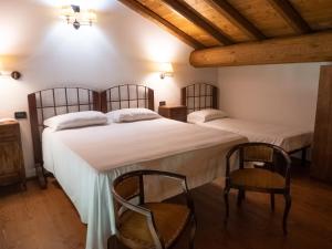 Postel nebo postele na pokoji v ubytování Agriturismo borgo del mincio