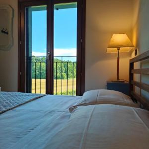 Postel nebo postele na pokoji v ubytování Agriturismo borgo del mincio