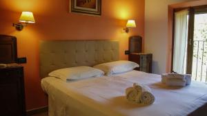Postel nebo postele na pokoji v ubytování Agriturismo borgo del mincio