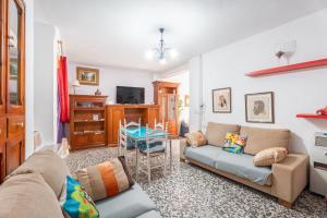 a living room with a couch and a table at Casa Ratón Pérez in Navarrés