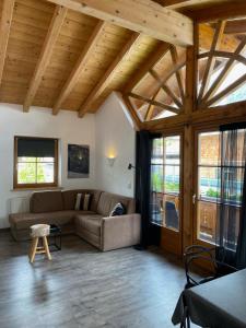 a living room with a couch and a table at Haus Albertha in Ehrwald
