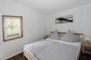 Ένα ή περισσότερα κρεβάτια σε δωμάτιο στο Ferienhaus 6 Campingpark Waldesruh