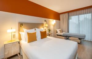 Postel nebo postele na pokoji v ubytování Hôtel Arcanse by Inwood Hotels