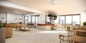 a dining room with tables and chairs and windows at Cavo Marelia in Amoopi