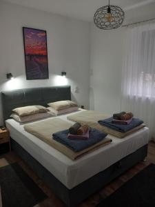 Ένα ή περισσότερα κρεβάτια σε δωμάτιο στο Apartman DEA