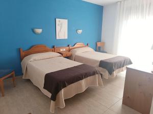 Postel nebo postele na pokoji v ubytování Hotel Rosi + 37 fotografií
