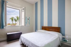 a bedroom with a bed and a window at 4 Bedroom Villa, Private Pool, Marsala in Marsala +34 photos
