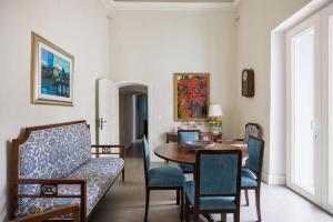 a dining room with a table and chairs at 4 Bedroom Villa, Private Pool, Marsala in Marsala
