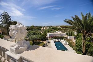 a view of a pool from the balcony of a house at 4 Bedroom Villa, Private Pool, Marsala in Marsala