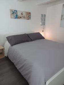 Posteľ alebo postele v izbe v ubytovaní Casa Antonella