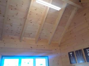 a room with a wooden ceiling in a house at #1 Le refuge et #2 Le Gite in Saint-Onésime +19 photos