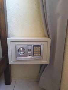 a wall mounted electrical outlet on a wall at Seaput Homes in Ayer Itam +13 photos