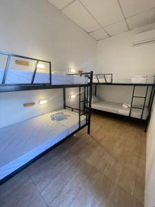 Postel nebo postele na pokoji v ubytování Grand'Hostel