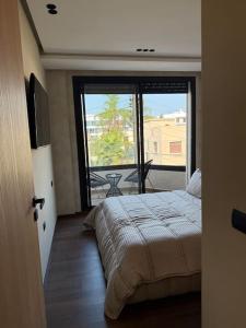 Ένα ή περισσότερα κρεβάτια σε δωμάτιο στο Appartement Casablanca Ghandi