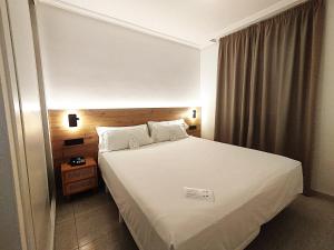 Posteľ alebo postele v izbe v ubytovaní Hotel Arena Beach