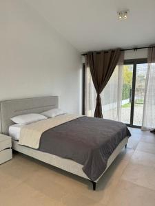Postel nebo postele na pokoji v ubytování Villa Paradiso