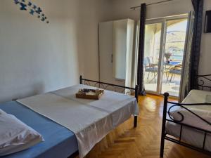 Ein Bett oder Betten in einem Zimmer der Unterkunft Apartments Josi