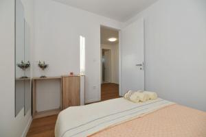 Posteľ alebo postele v izbe v ubytovaní Apartment Nata