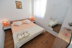 Posteľ alebo postele v izbe v ubytovaní Apartment Nata