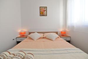 Posteľ alebo postele v izbe v ubytovaní Apartment Nata