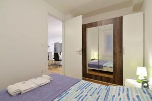 Posteľ alebo postele v izbe v ubytovaní Apartment Nata