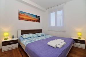 Posteľ alebo postele v izbe v ubytovaní Apartment Nata