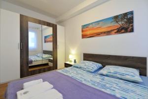 Posteľ alebo postele v izbe v ubytovaní Apartment Nata + 28 fotografií