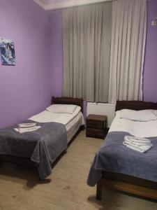 Postel nebo postele na pokoji v ubytování SWEETHOSTEL