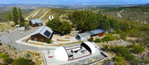 an aerial view of a house on a hill at Observatorio Ampimpa in Amaicha del Valle