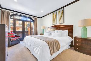 a bedroom with a large bed and a window at Town Lift 2C on Main Street in Park City