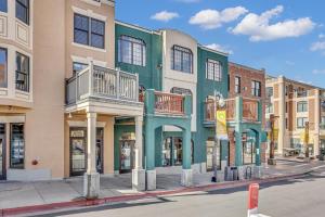 a green building with balconies on a city street at Town Lift 2C on Main Street in Park City