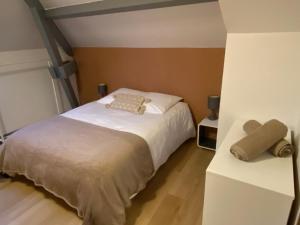 Postel nebo postele na pokoji v ubytování Le Piton - Appartements
