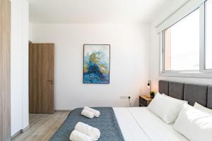 Un pat sau paturi într-o cameră la Villa Elite Blu by Ezoria Villas