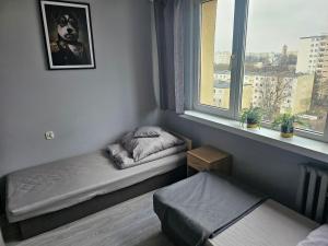 Ένα ή περισσότερα κρεβάτια σε δωμάτιο στο The First Atlas Arena Apartament