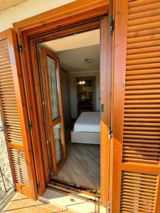 an open door to a bedroom with a bed in it at Casa Vittoria in Artena +13 photos