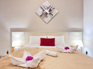 a bedroom with a large bed with two pillows at ☆The Central Valencia Stay☆ in Valencia
