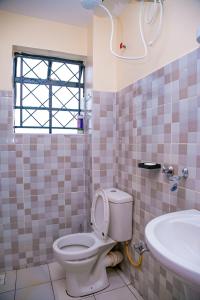 Koupelna v ubytování Dreamy Abode 1BR Kisumu