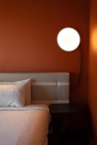 a bedroom with a bed and a round window at Radisson Blu Hotel Bordeaux in Bordeaux