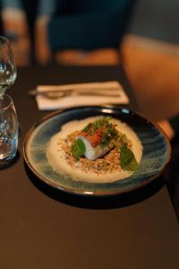 a plate of food sitting on a table at Radisson Blu Hotel Bordeaux in Bordeaux