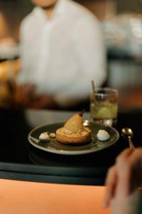 a plate with a dessert on a table at Radisson Blu Hotel Bordeaux in Bordeaux