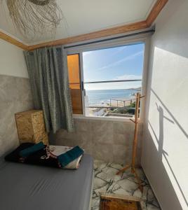 Postel nebo postele na pokoji v ubytování Sweet Surf Hostel