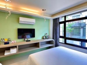 Una cama o camas en una habitación de 漫調子 Roaming Life B&B